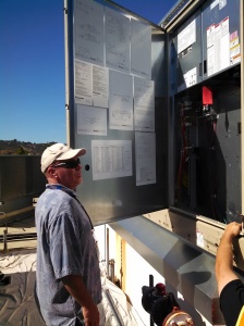 Cam Isaza of Marin Department of Public Works inspects the new unit.
